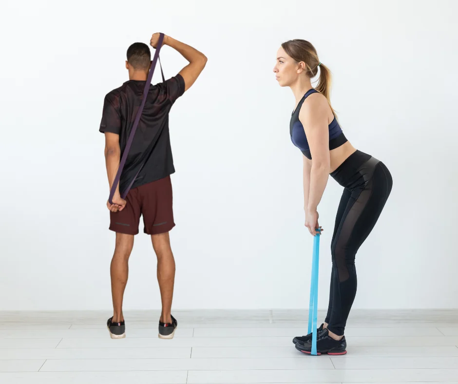 Two people performing resistance-band exercises