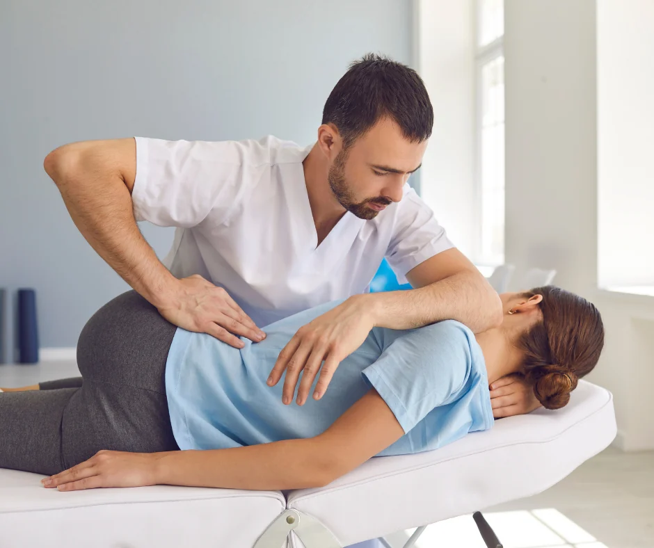 Chiropractor performing a spinal adjustment